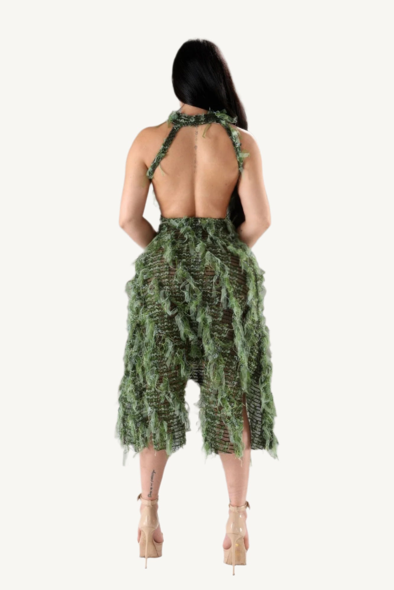 Halter ruffled dress with elegant neckline and layered ruffle details. A stylish and comfortable piece designed to blend modern flair with timeless elegance.