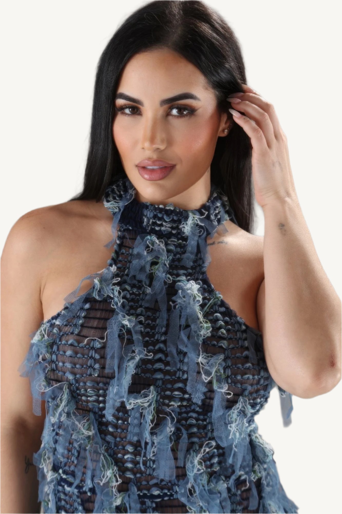 Elegant halter ruffled dress with a modern silhouette, featuring soft layered ruffles and a flattering neckline. Designed for comfort, style, and sophistication.