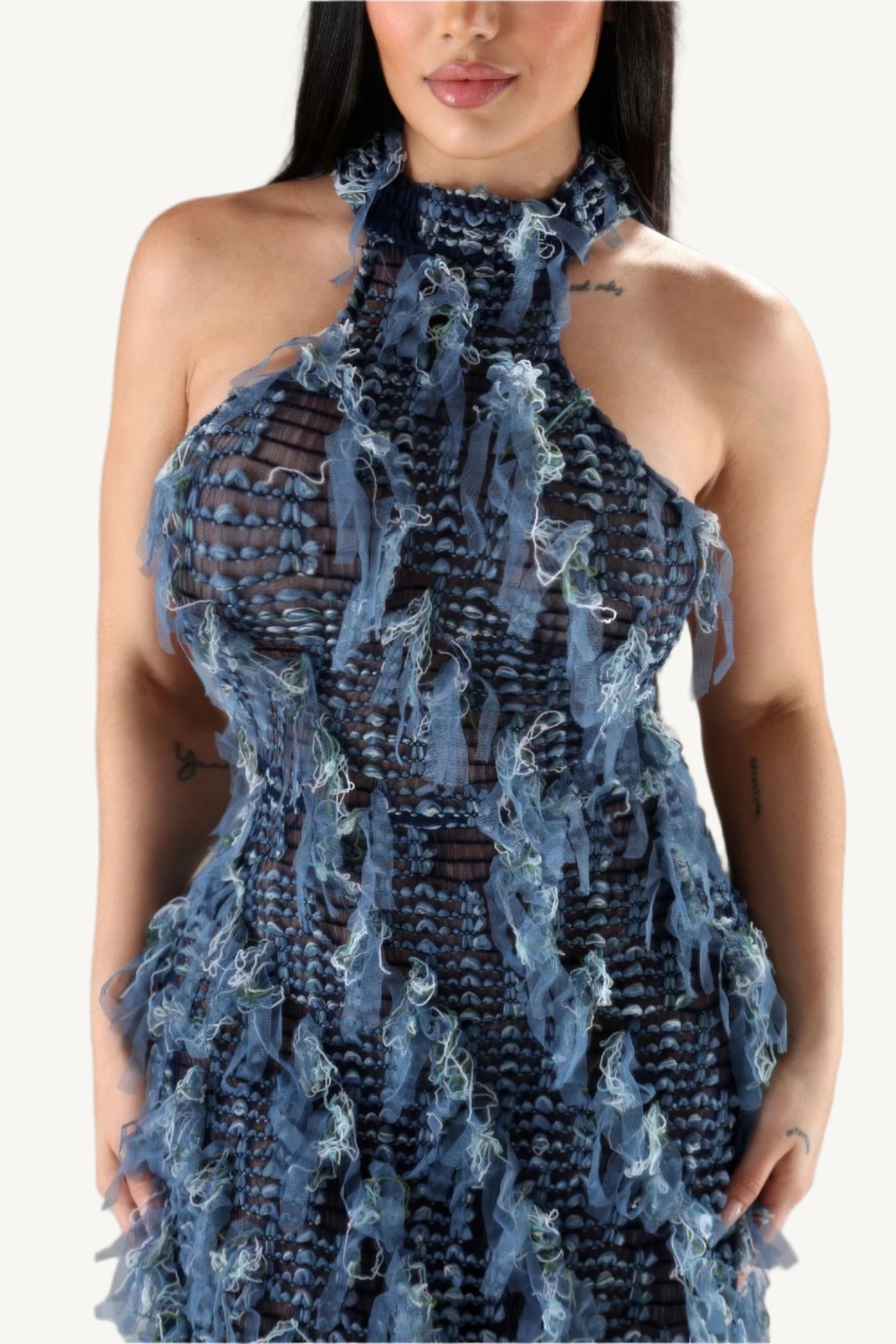Elegant halter ruffled dress with a modern silhouette, featuring soft layered ruffles and a flattering neckline. Designed for comfort, style, and sophistication.