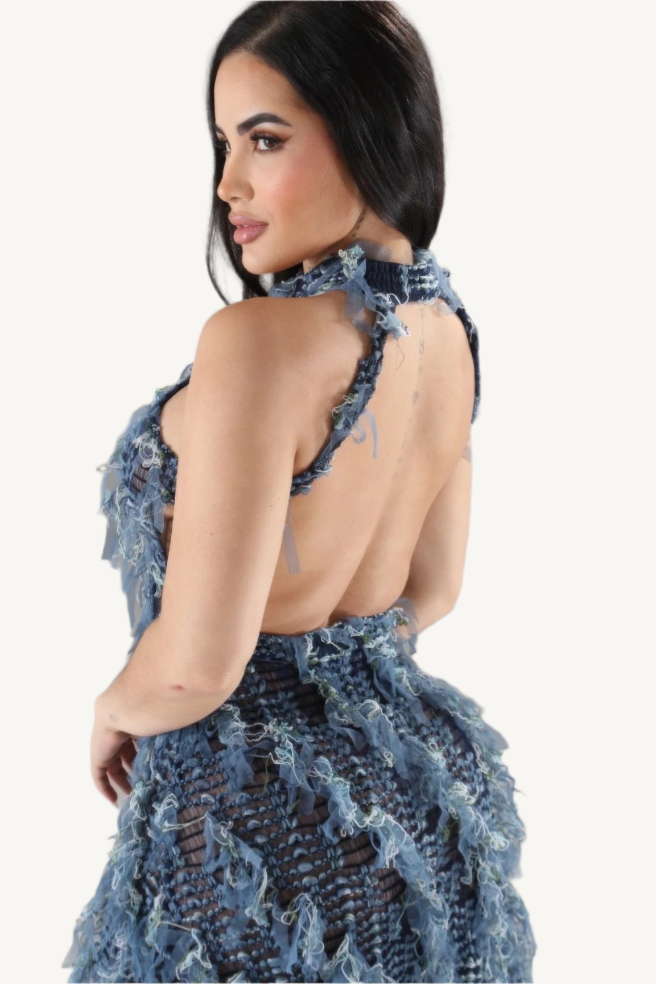 Elegant halter ruffled dress with a modern silhouette, featuring soft layered ruffles and a flattering neckline. Designed for comfort, style, and sophistication.