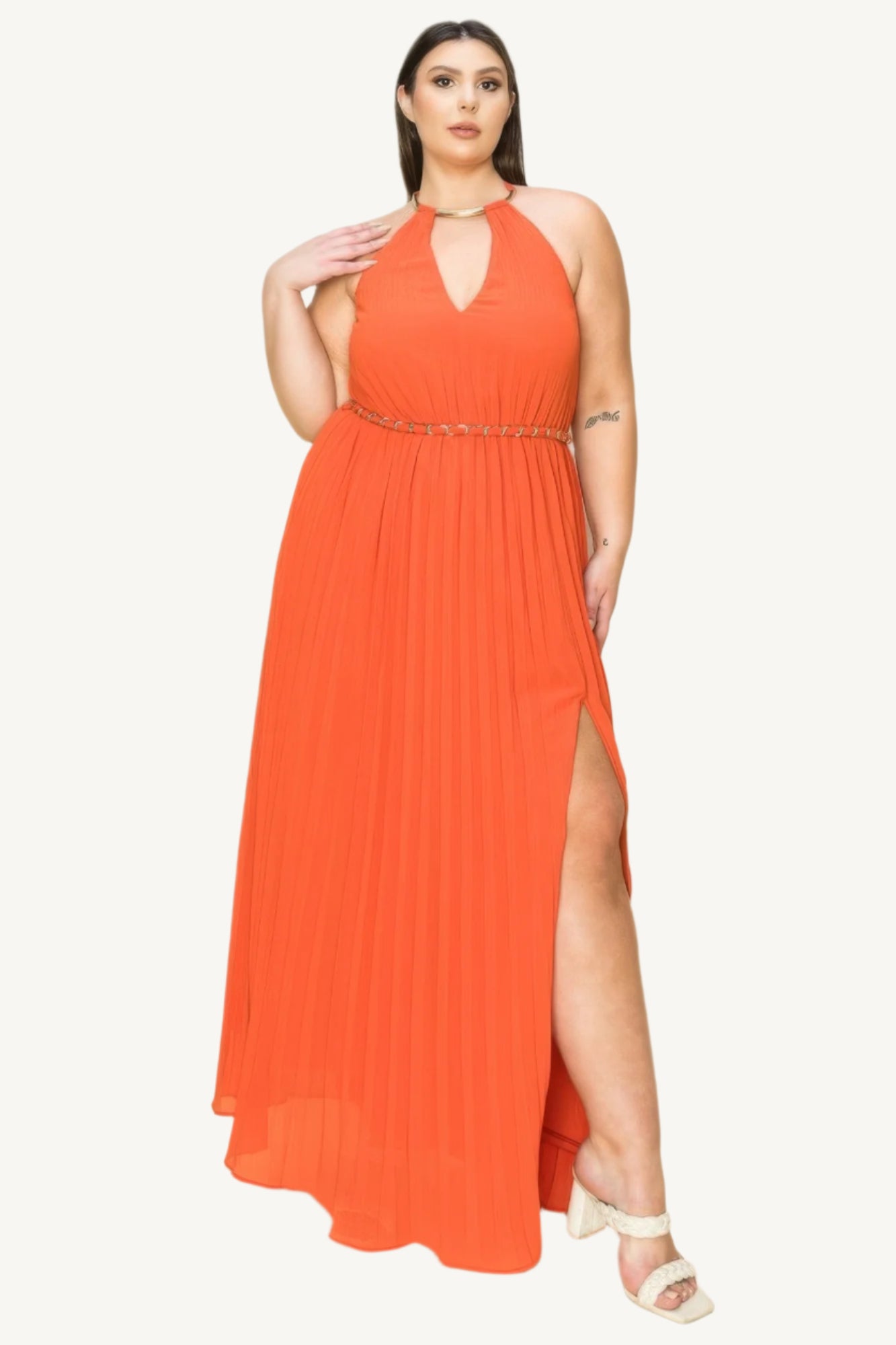 "Chiffon pleated maxi dress with gold trim neckline, cut-out chest detail, and matching belt, designed for a timeless and elegant look."