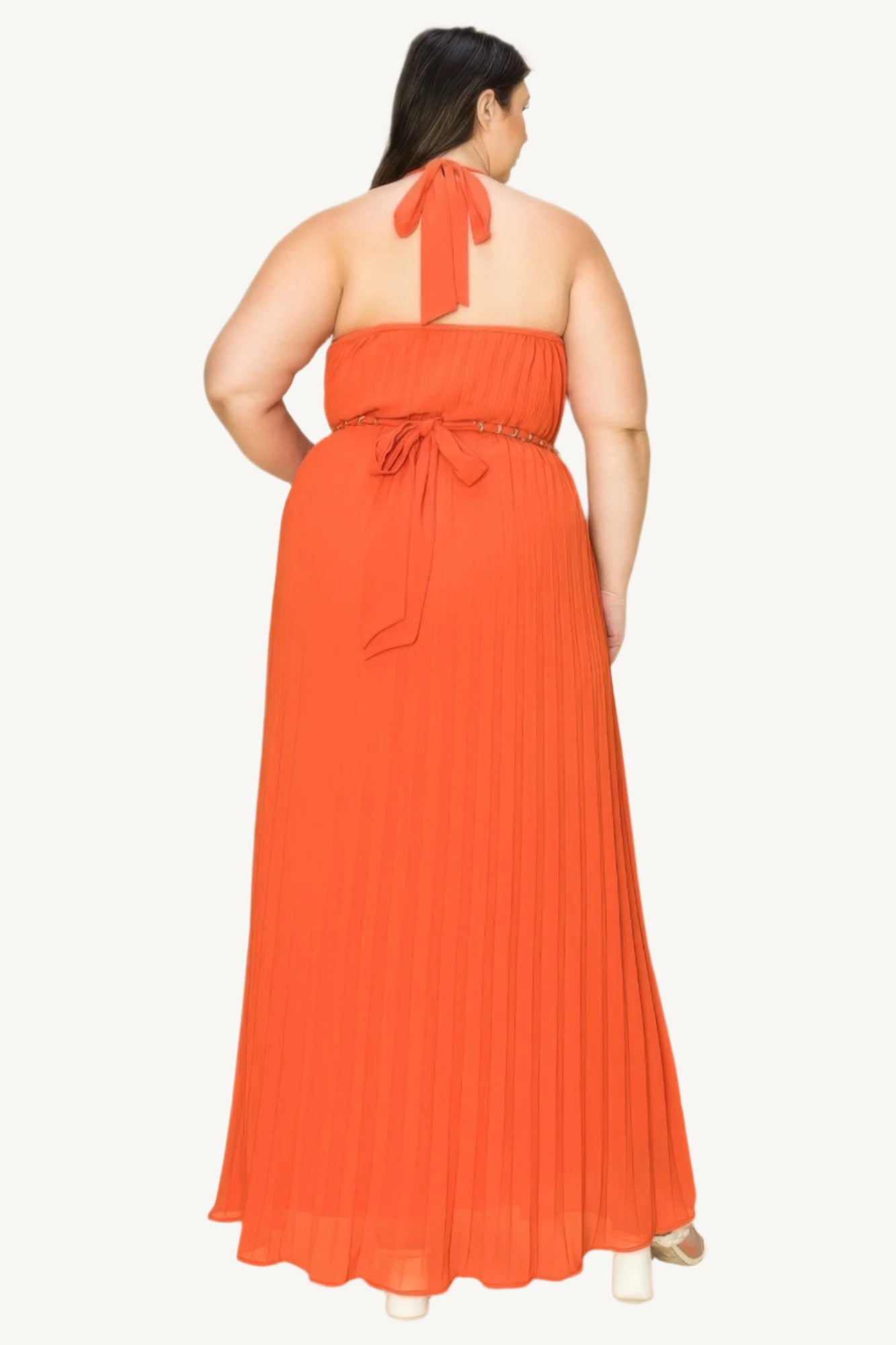 "Chiffon pleated maxi dress with gold trim neckline, cut-out chest detail, and matching belt, designed for a timeless and elegant look."