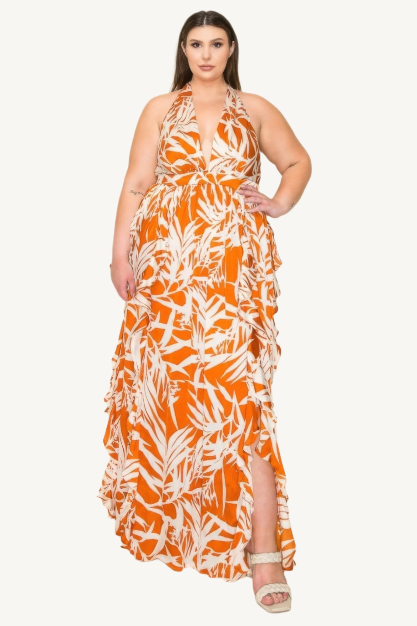 "Crinkle satin printed halter maxi dress with ruffle details, smocked waist, and front slit, offering a flowy, elegant, and flattering silhouette."