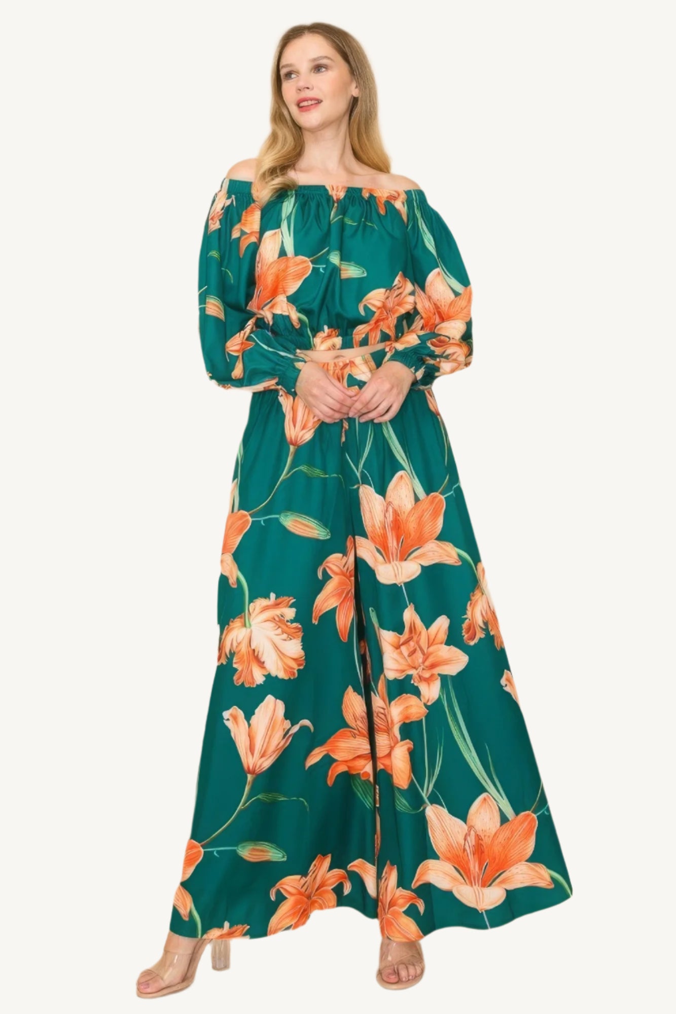 Off-shoulder top and wide-leg pants set with elastic detailing. Made from a luxurious blend of 90% polyester and 10% nylon for a chic, comfortable, and effortless look.