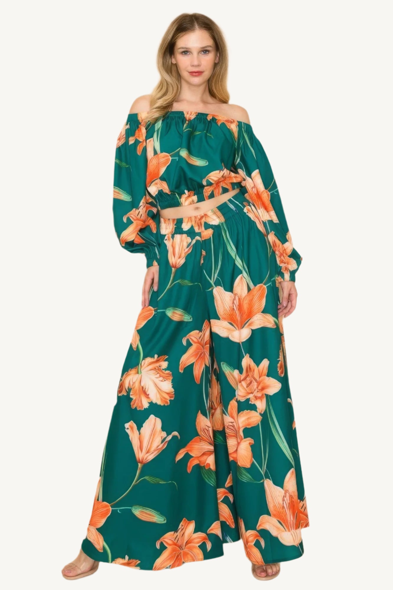 Off-shoulder top and wide-leg pants set with elastic detailing. Made from a luxurious blend of 90% polyester and 10% nylon for a chic, comfortable, and effortless look.