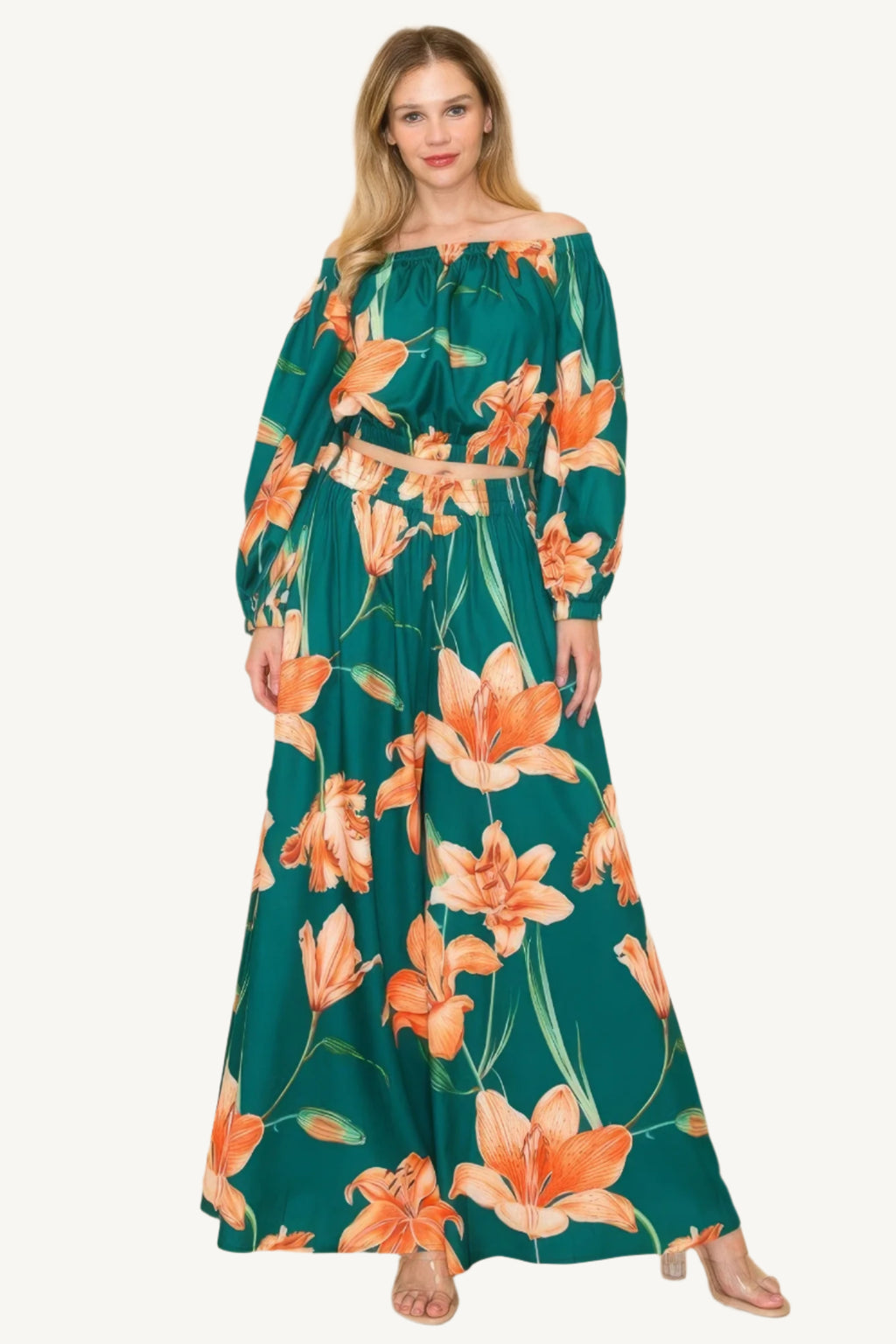 Off-shoulder top and wide-leg pants set with elastic detailing. Made from a luxurious blend of 90% polyester and 10% nylon for a chic, comfortable, and effortless look.