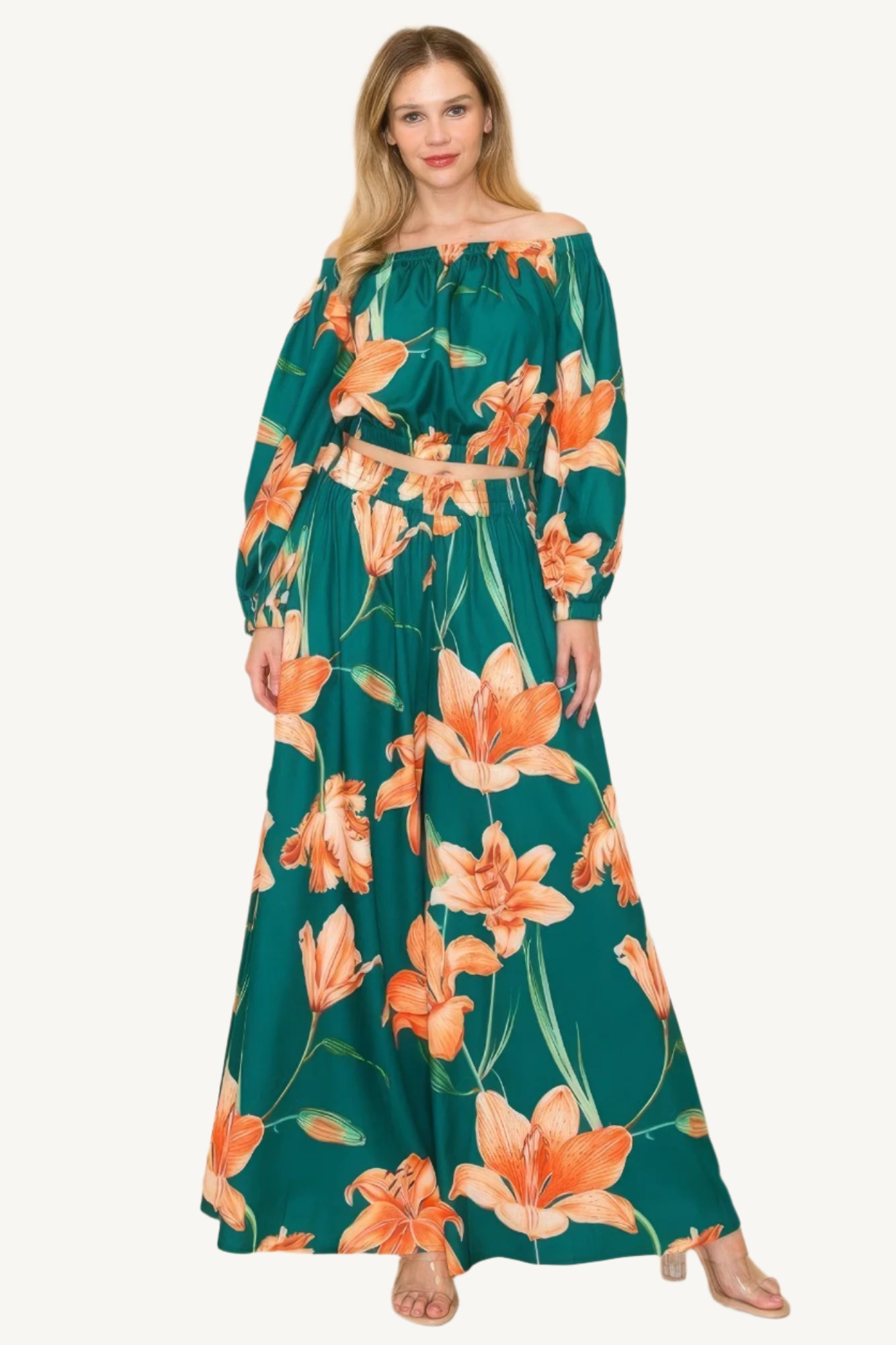 Off-shoulder top and wide-leg pants set with elastic detailing. Made from a luxurious blend of 90% polyester and 10% nylon for a chic, comfortable, and effortless look.