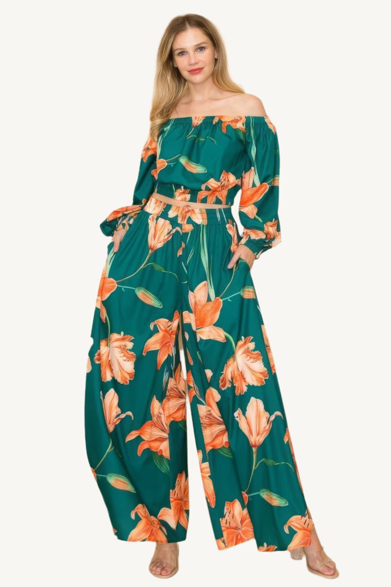 Off-shoulder top and wide-leg pants set with elastic detailing. Made from a luxurious blend of 90% polyester and 10% nylon for a chic, comfortable, and effortless look.