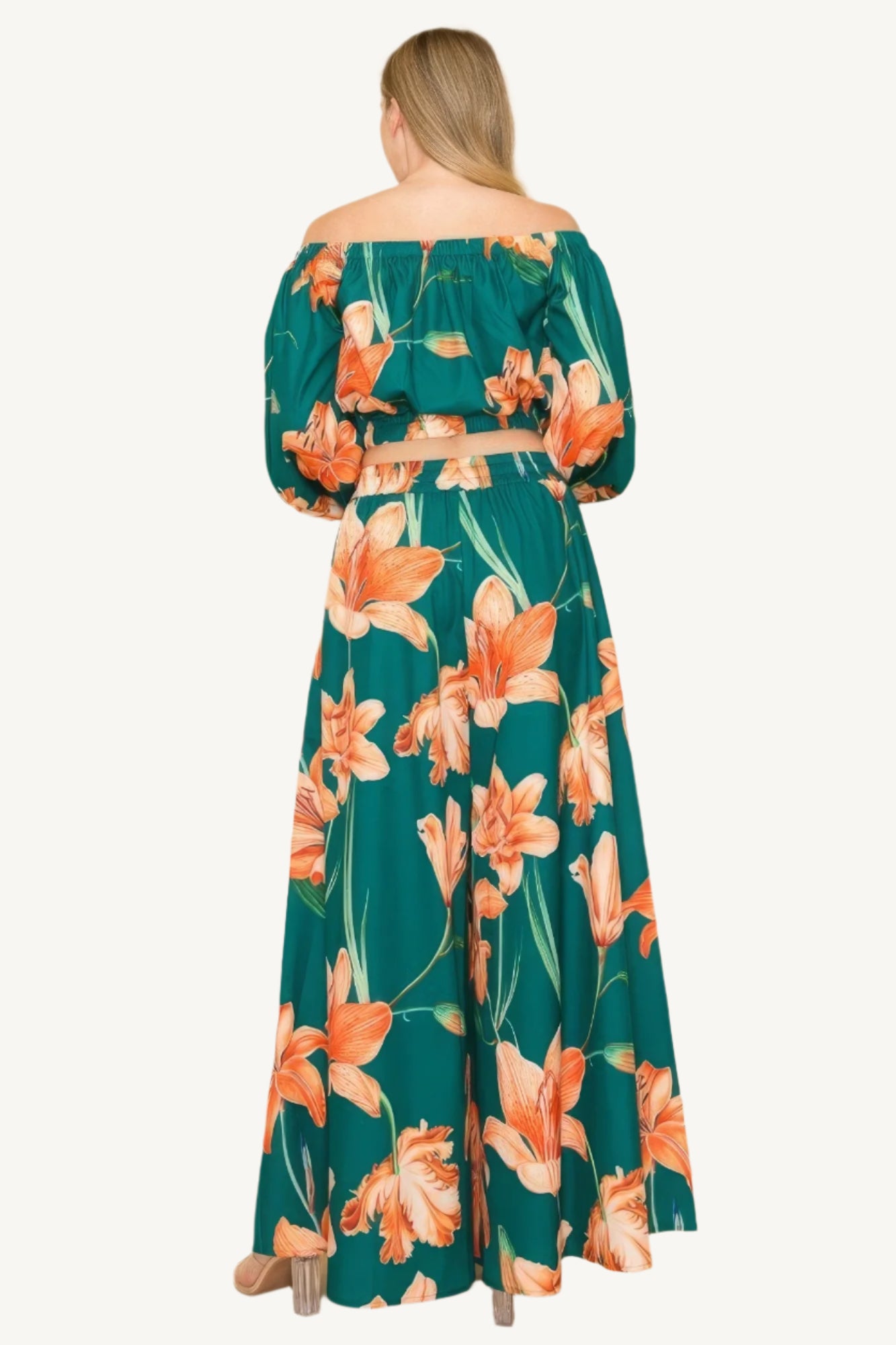 Off-shoulder top and wide-leg pants set with elastic detailing. Made from a luxurious blend of 90% polyester and 10% nylon for a chic, comfortable, and effortless look.