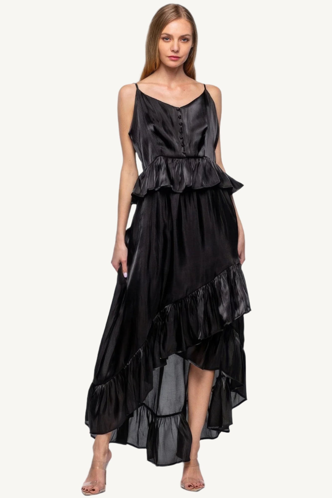 Sleeveless ruffle dress with adjustable straps and asymmetric hem, crafted from 100% polyester for a flowing, elegant silhouette with a soft shimmer.