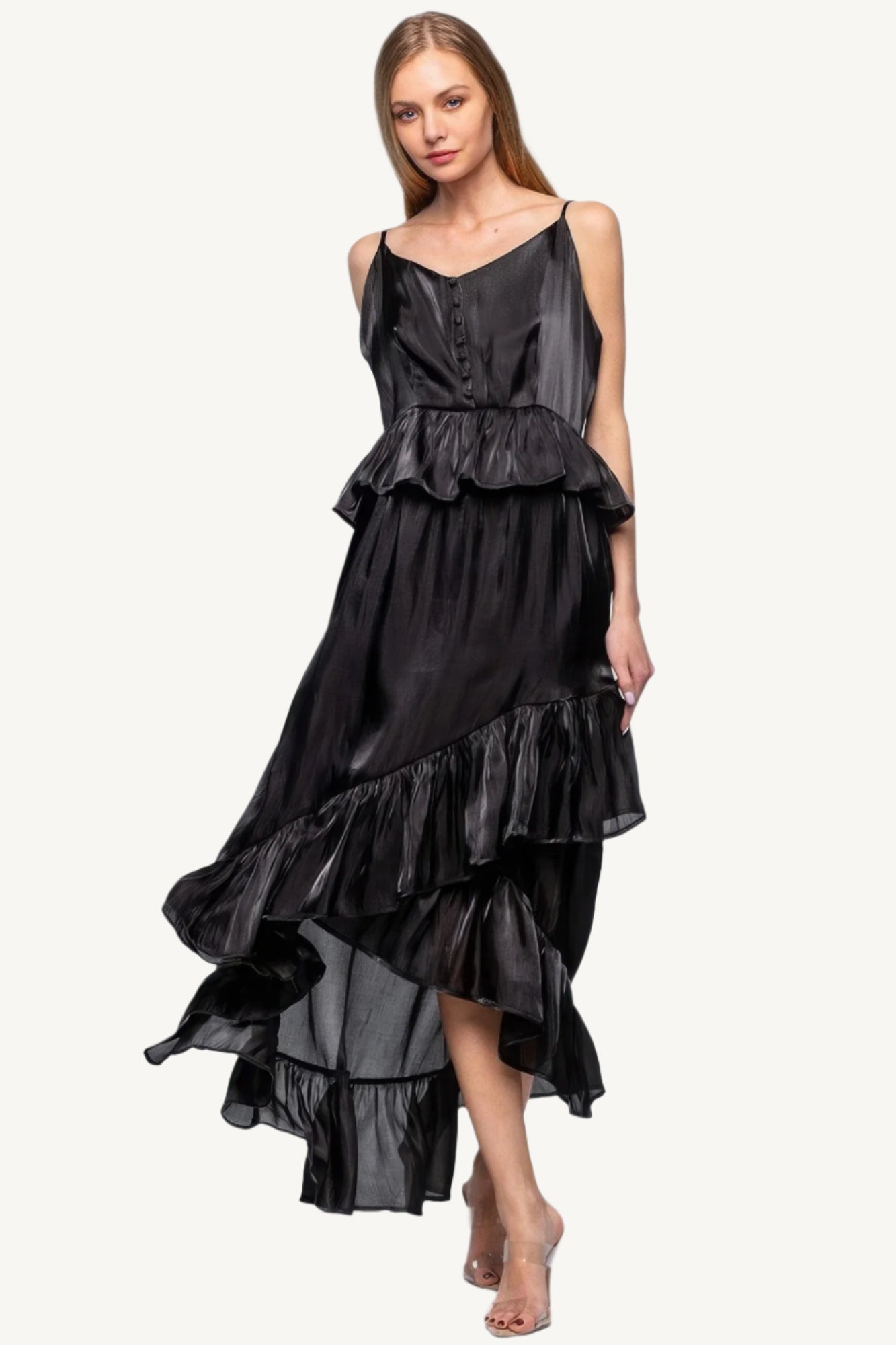 Sleeveless ruffle dress with adjustable straps and asymmetric hem, crafted from 100% polyester for a flowing, elegant silhouette with a soft shimmer.