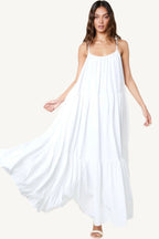 Flowy maxi sun dress with adjustable straps, extra-wide A-line silhouette, and side pockets. Designed for comfort, elegance, and warm-weather ease.