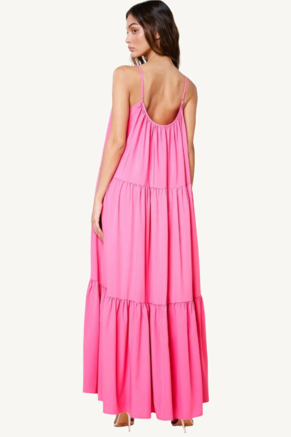 Maxi sun dress with adjustable straps, roomy side pockets, and an extra-wide A-line silhouette. A breezy and stylish choice for warm sunny days.
