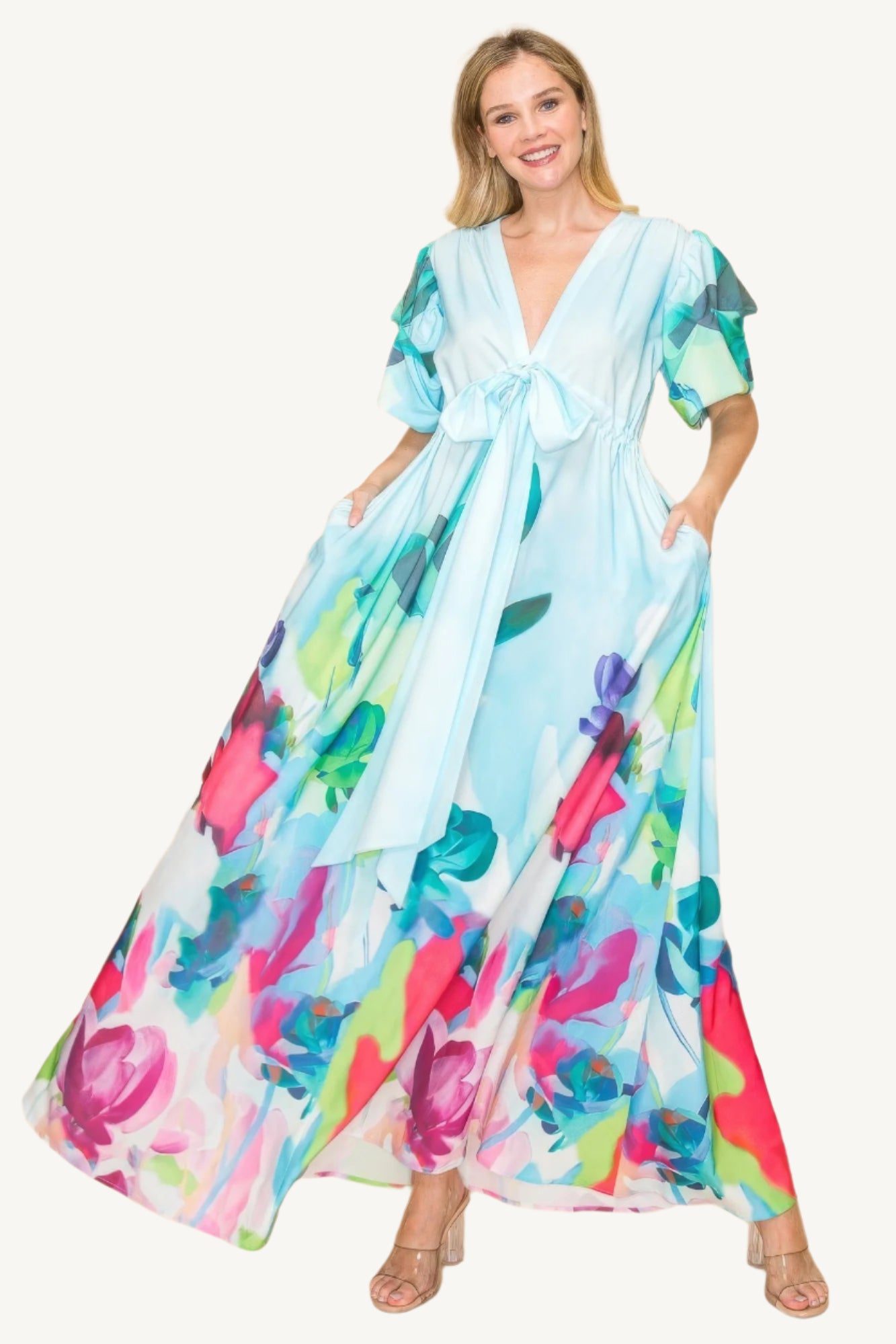 Printed V-neck maxi dress with self-tie waist ribbon, elastic waistband, and side pockets. Made from 100% polyester in a vibrant multi-colored print for a flattering, comfortable fit.