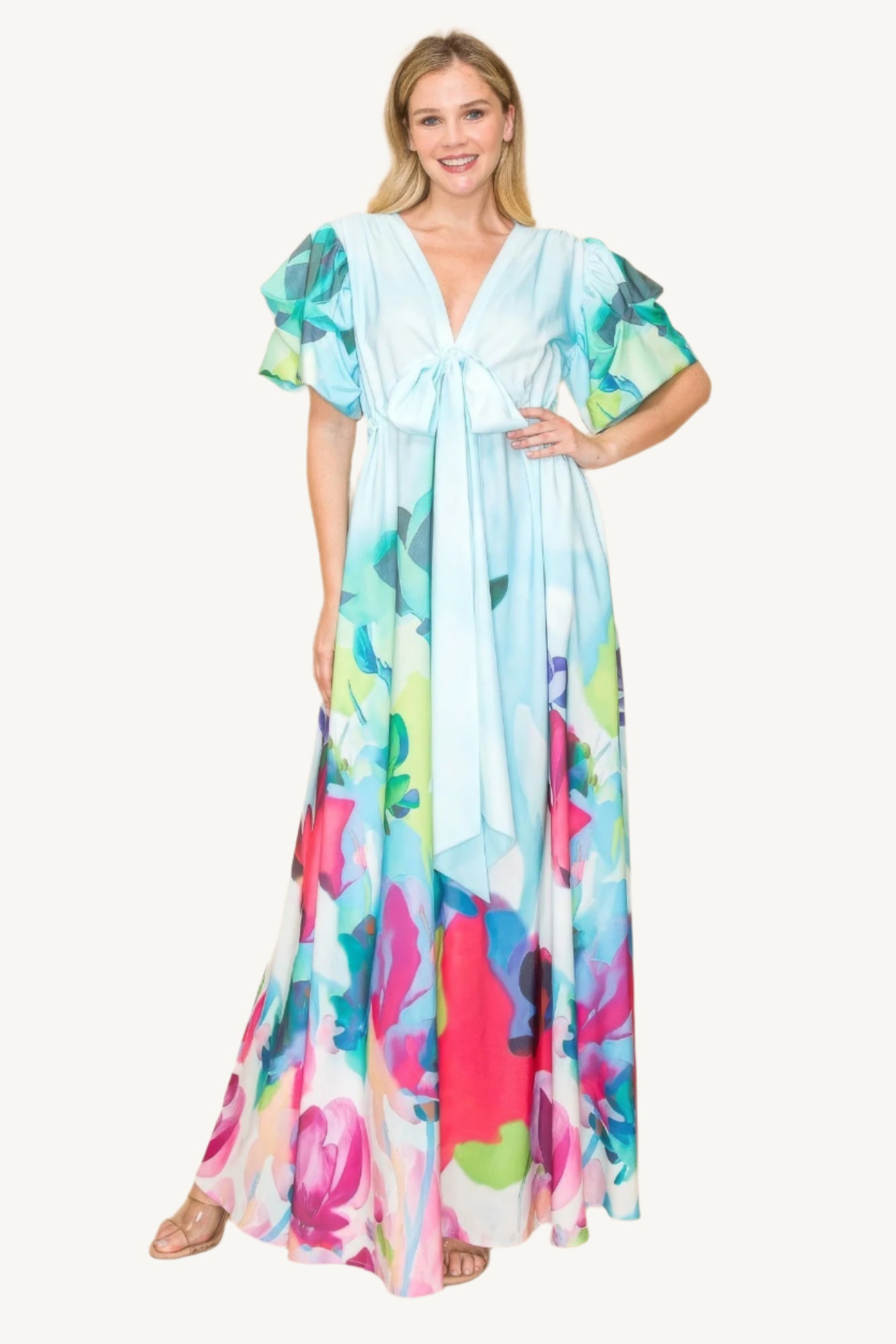 Printed V-neck maxi dress with self-tie waist ribbon, elastic waistband, and side pockets. Made from 100% polyester in a vibrant multi-colored print for a flattering, comfortable fit.
