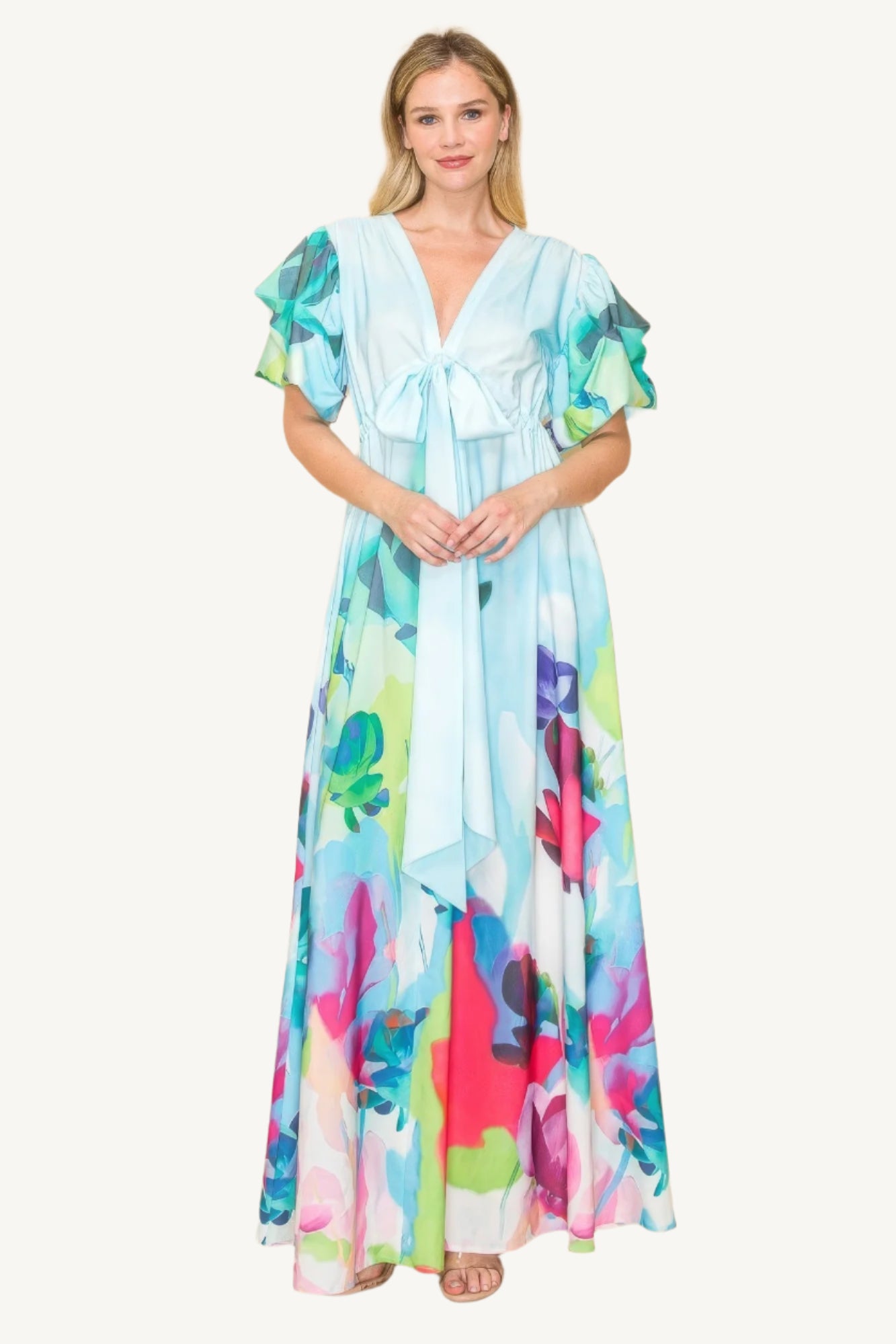 Printed V-neck maxi dress with self-tie waist ribbon, elastic waistband, and side pockets. Made from 100% polyester in a vibrant multi-colored print for a flattering, comfortable fit.