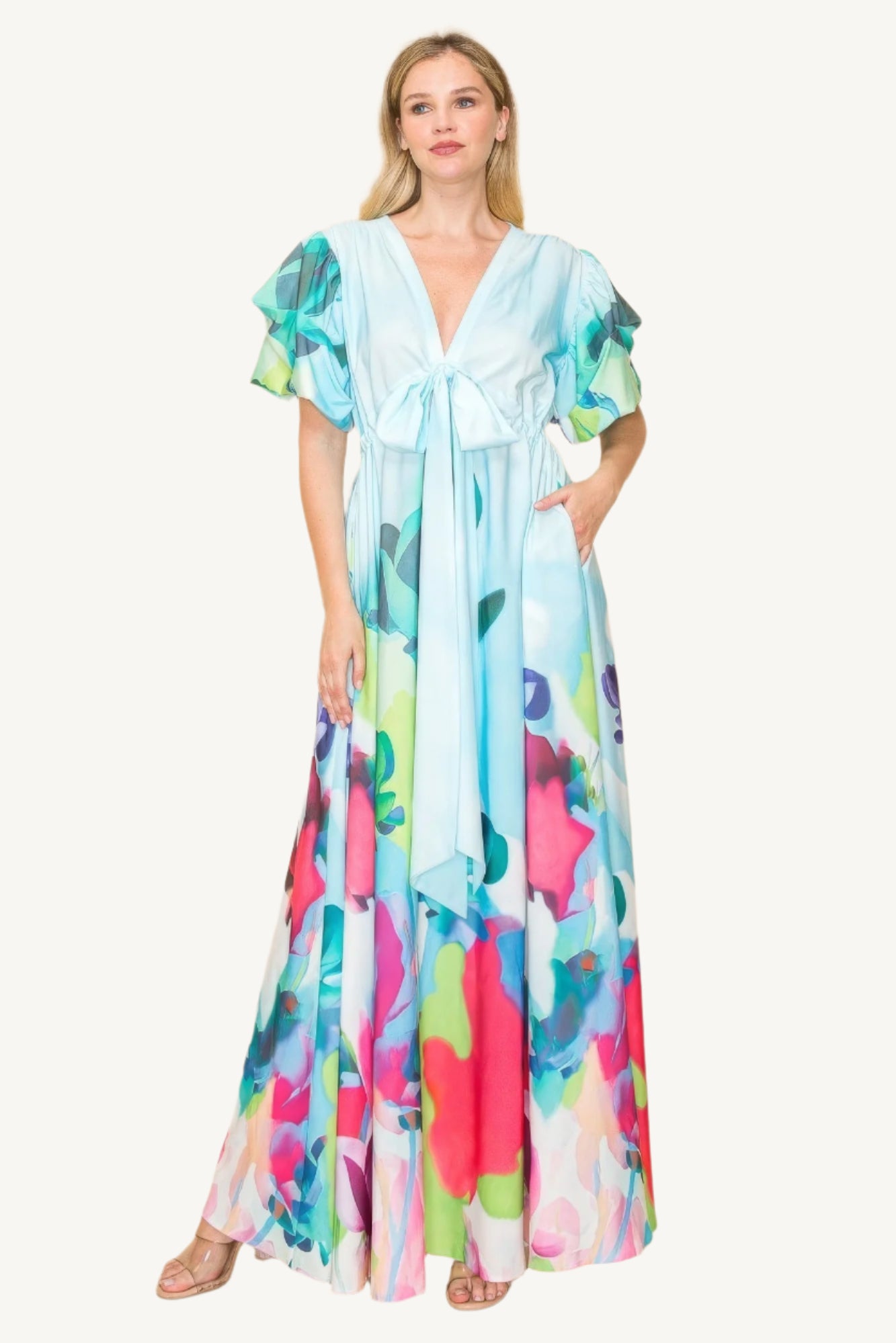 Printed V-neck maxi dress with self-tie waist ribbon, elastic waistband, and side pockets. Made from 100% polyester in a vibrant multi-colored print for a flattering, comfortable fit.