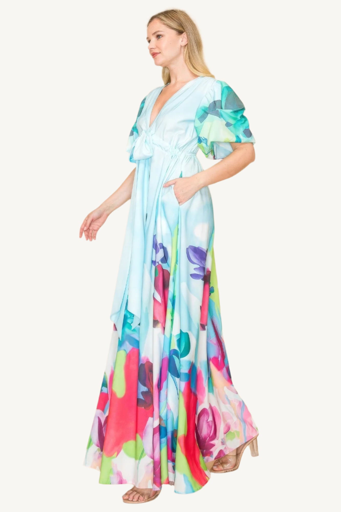 Printed V-neck maxi dress with self-tie waist ribbon, elastic waistband, and side pockets. Made from 100% polyester in a vibrant multi-colored print for a flattering, comfortable fit.