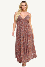 "Floral maxi dress with tie back, featuring a romantic flowy silhouette and elegant floral print for versatile occasions."