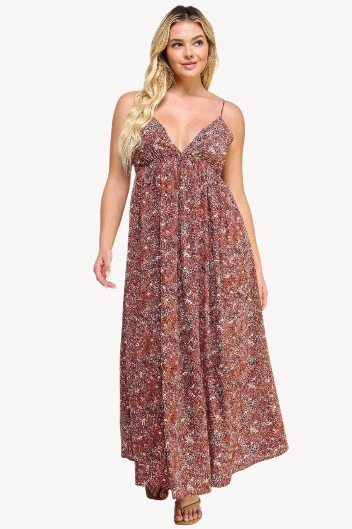 "Floral maxi dress with tie back, featuring a romantic flowy silhouette and elegant floral print for versatile occasions."