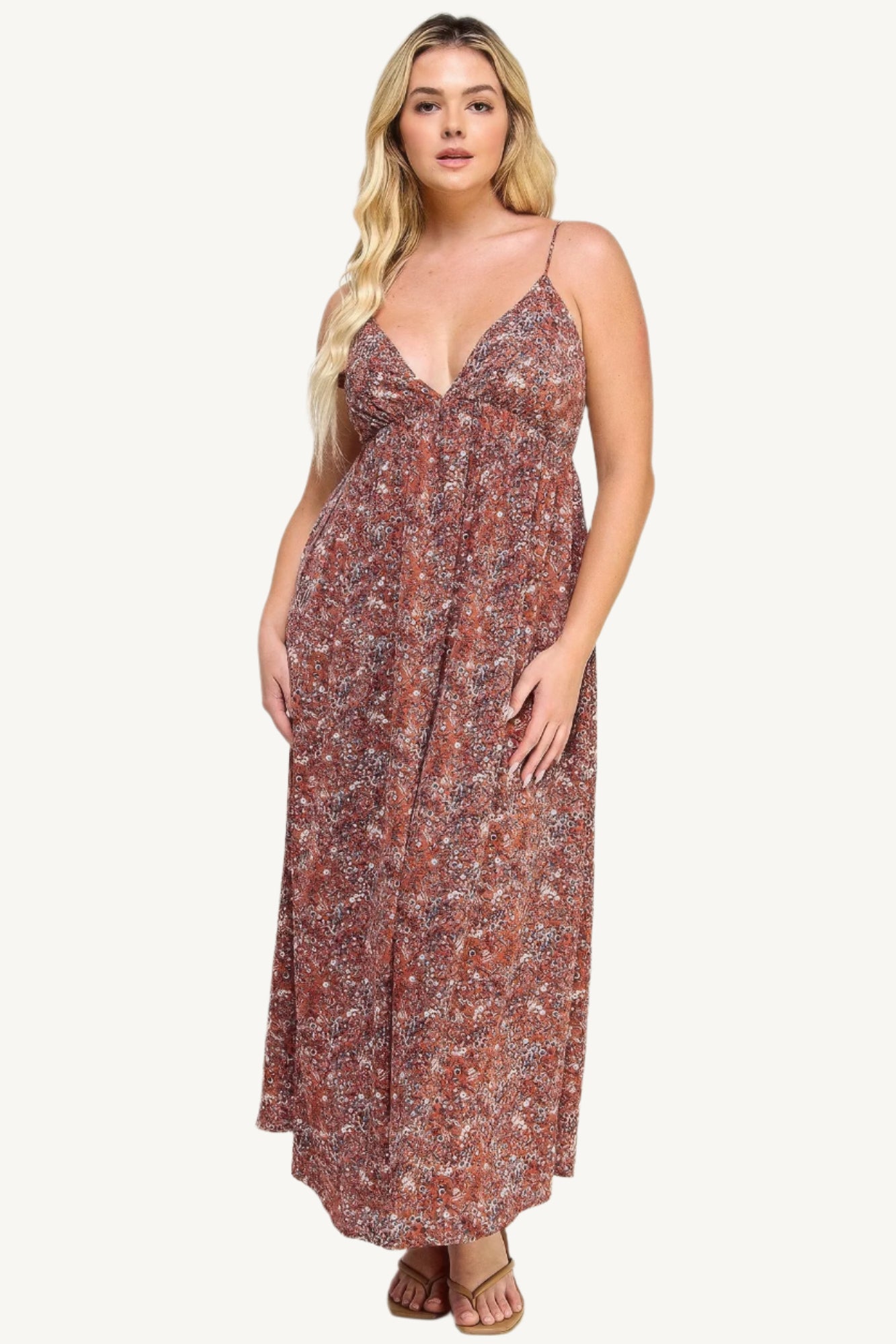 "Floral maxi dress with tie back, featuring a romantic flowy silhouette and elegant floral print for versatile occasions."