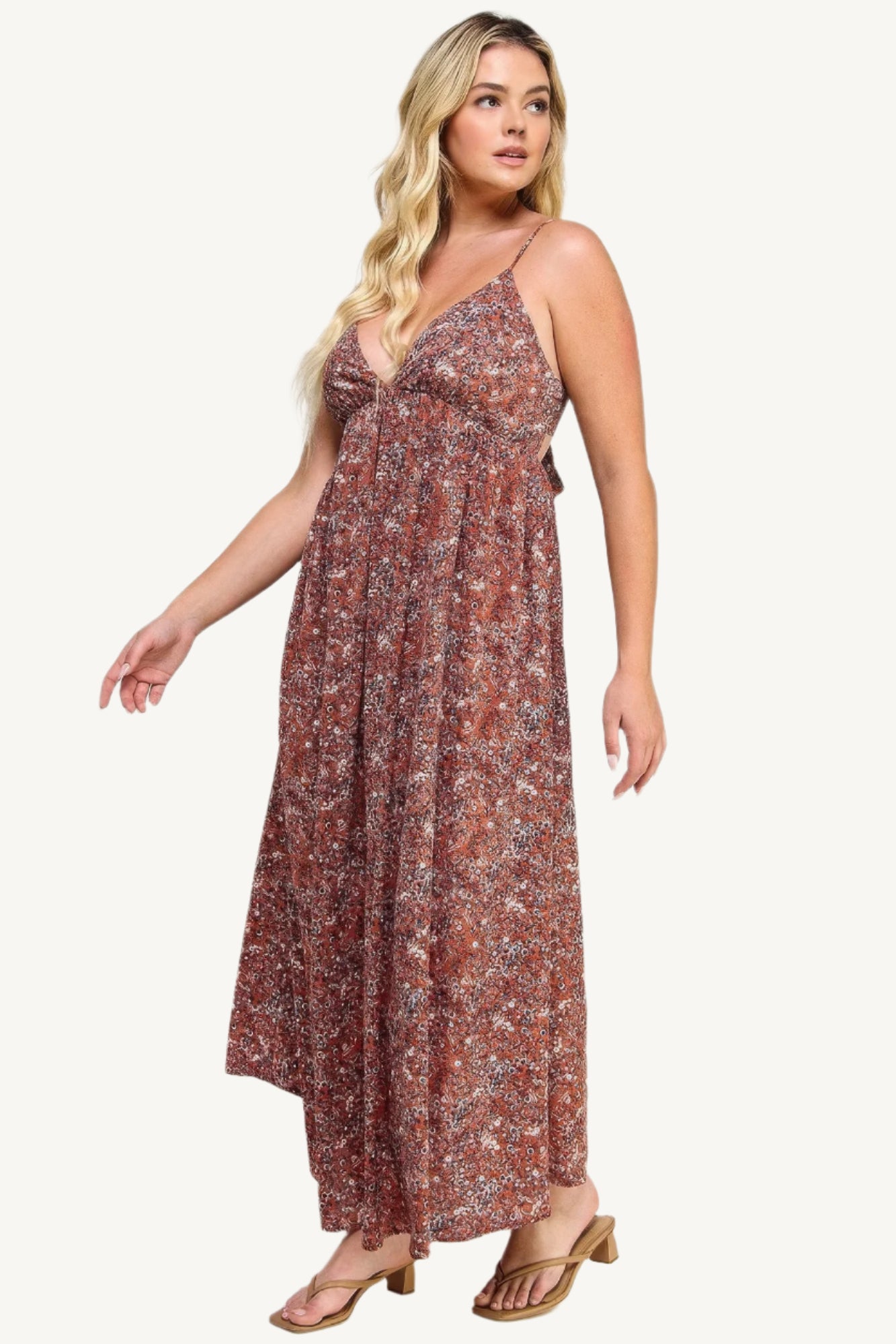 "Floral maxi dress with tie back, featuring a romantic flowy silhouette and elegant floral print for versatile occasions."