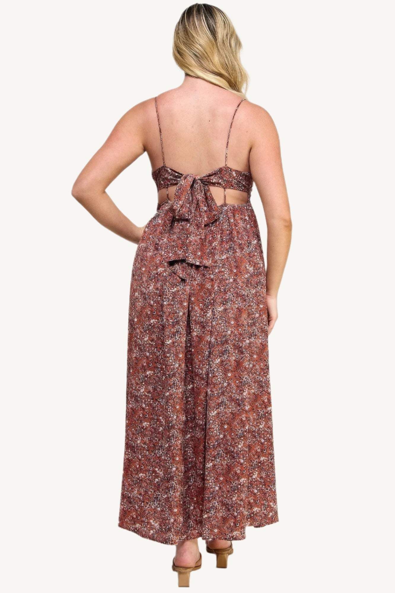 "Floral maxi dress with tie back, featuring a romantic flowy silhouette and elegant floral print for versatile occasions."
