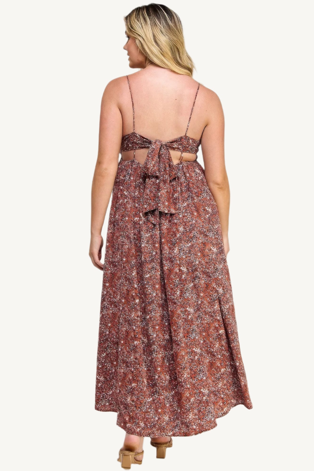 "Floral maxi dress with tie back, featuring a romantic flowy silhouette and elegant floral print for versatile occasions."