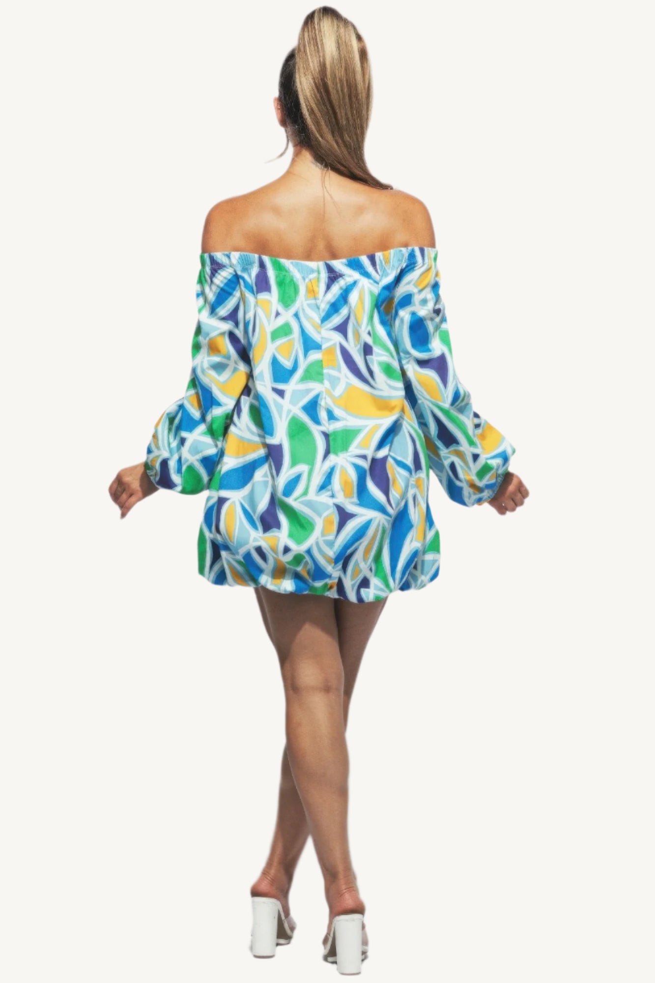 Chic off shoulder bubble mini dress crafted from high-quality fabric. A modern, playful yet elegant piece designed to turn heads at any event.