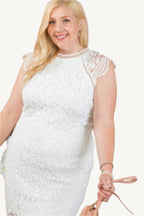 Lace crochet mini dress with raglan sleeves and zipper back. Elegant and feminine design perfect for semi-formal and stylish daytime occasions.