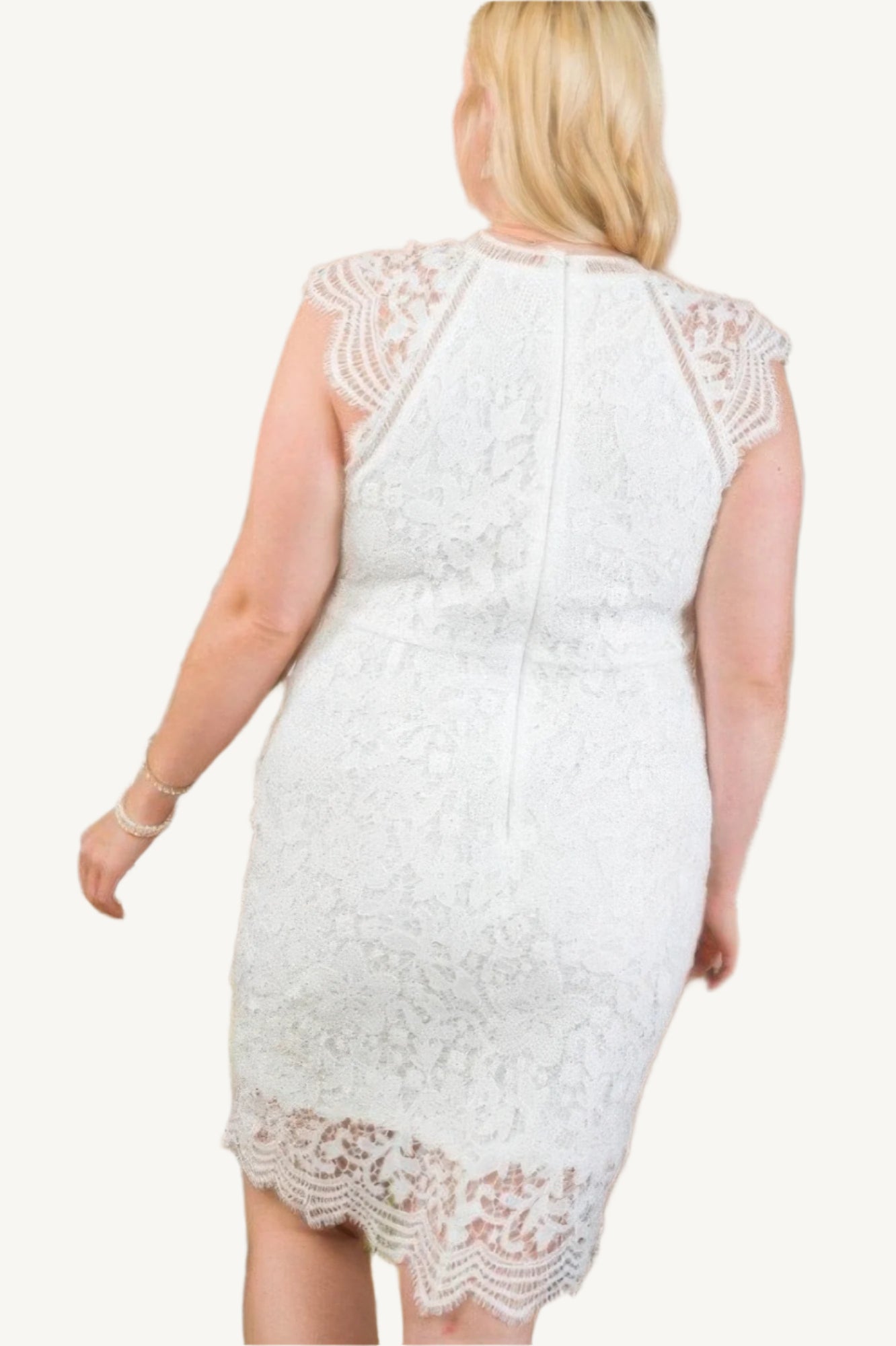 Lace crochet mini dress with raglan sleeves and zipper back. Elegant and feminine design perfect for semi-formal and stylish daytime occasions.