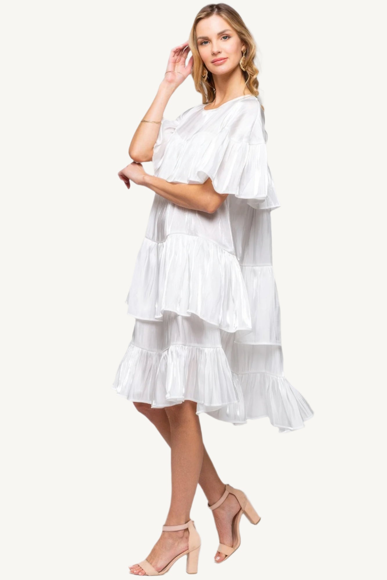 "White ruffle midi dress – elegant, shimmering fabric with a chic silhouette perfect for special occasions."
