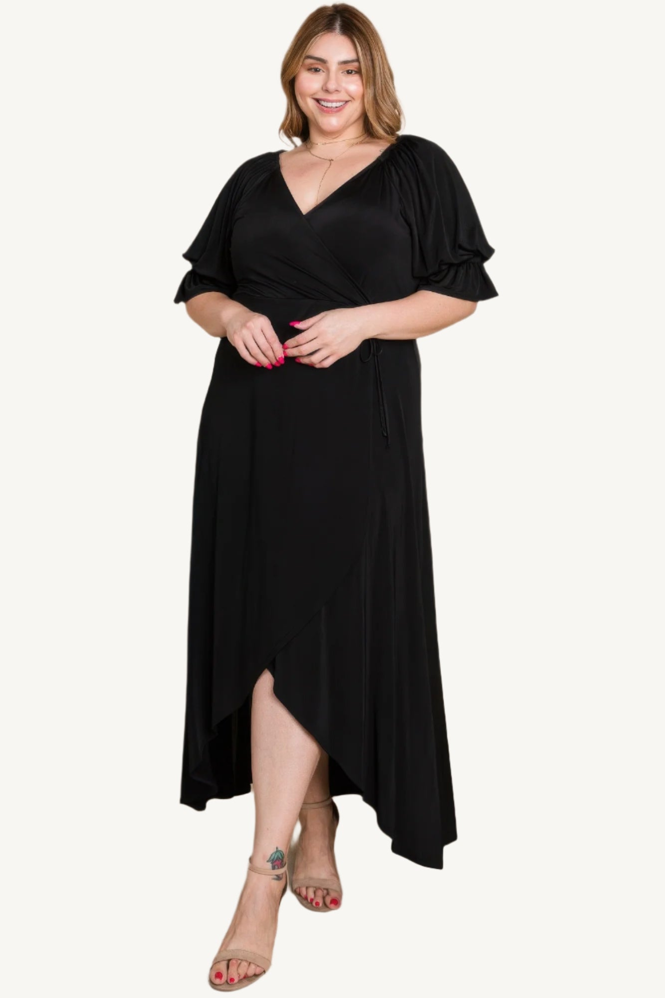 Plus-size solid color faux wrap maxi dress with Venezia fabric finish. Elegant silhouette offering style, comfort, and versatility for all occasions.