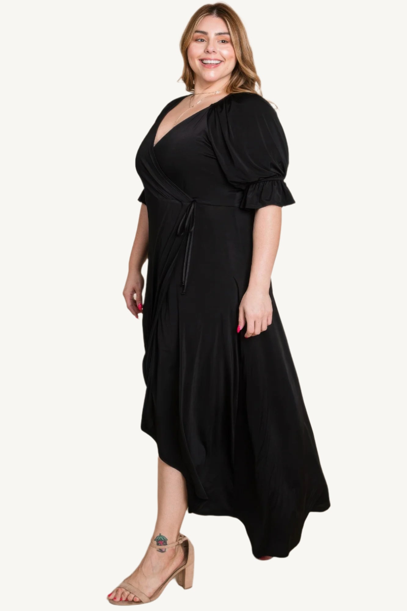 Plus-size solid color faux wrap maxi dress with Venezia fabric finish. Elegant silhouette offering style, comfort, and versatility for all occasions.