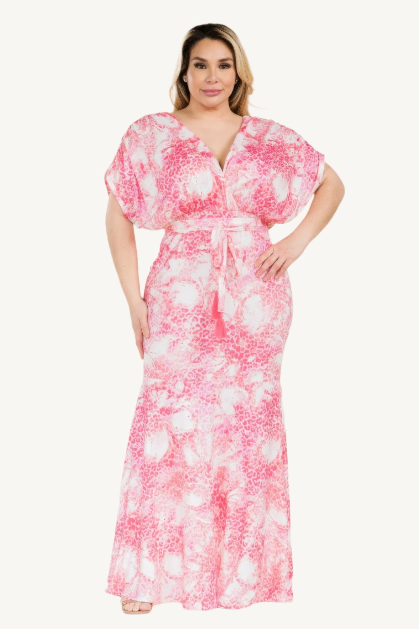 Plus-size printed mermaid maxi dress with tie waist and bold Venezia-inspired pattern. Flattering silhouette designed for elegant evenings and special occasions.