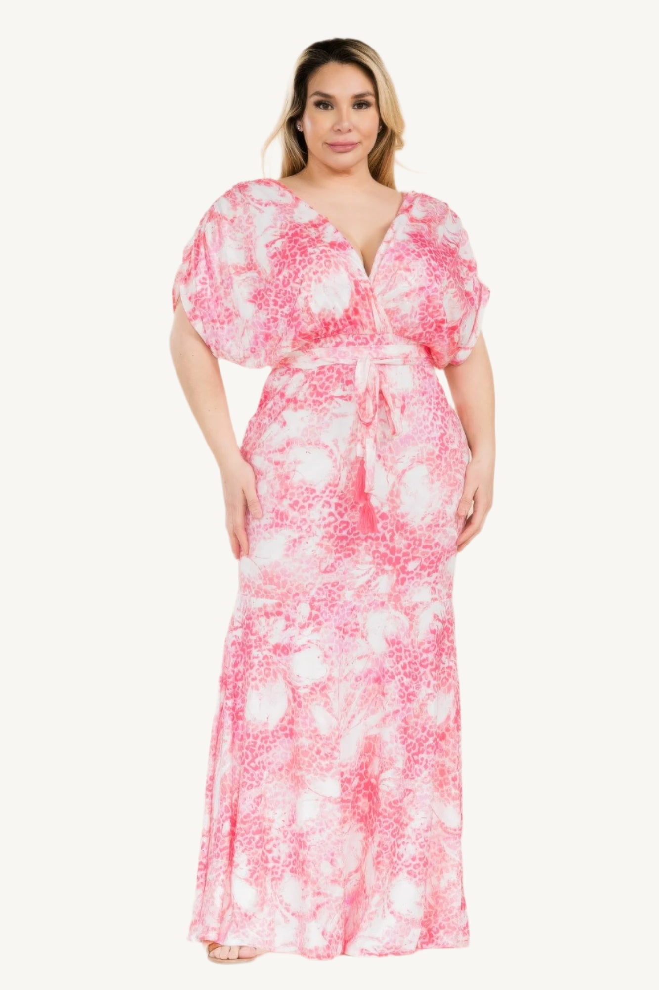 Plus-size printed mermaid maxi dress with tie waist and bold Venezia-inspired pattern. Flattering silhouette designed for elegant evenings and special occasions.