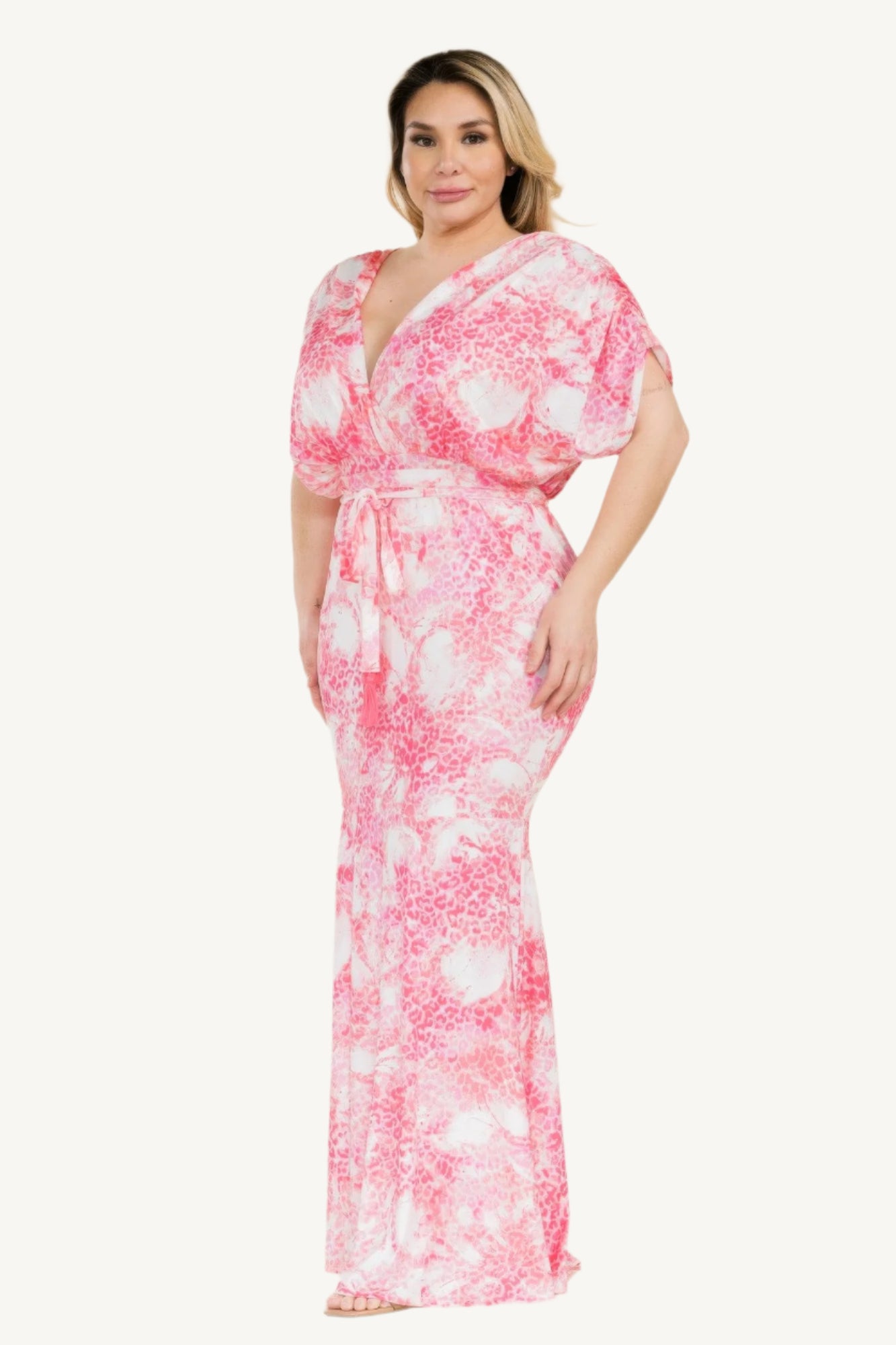 Plus-size printed mermaid maxi dress with tie waist and bold Venezia-inspired pattern. Flattering silhouette designed for elegant evenings and special occasions.