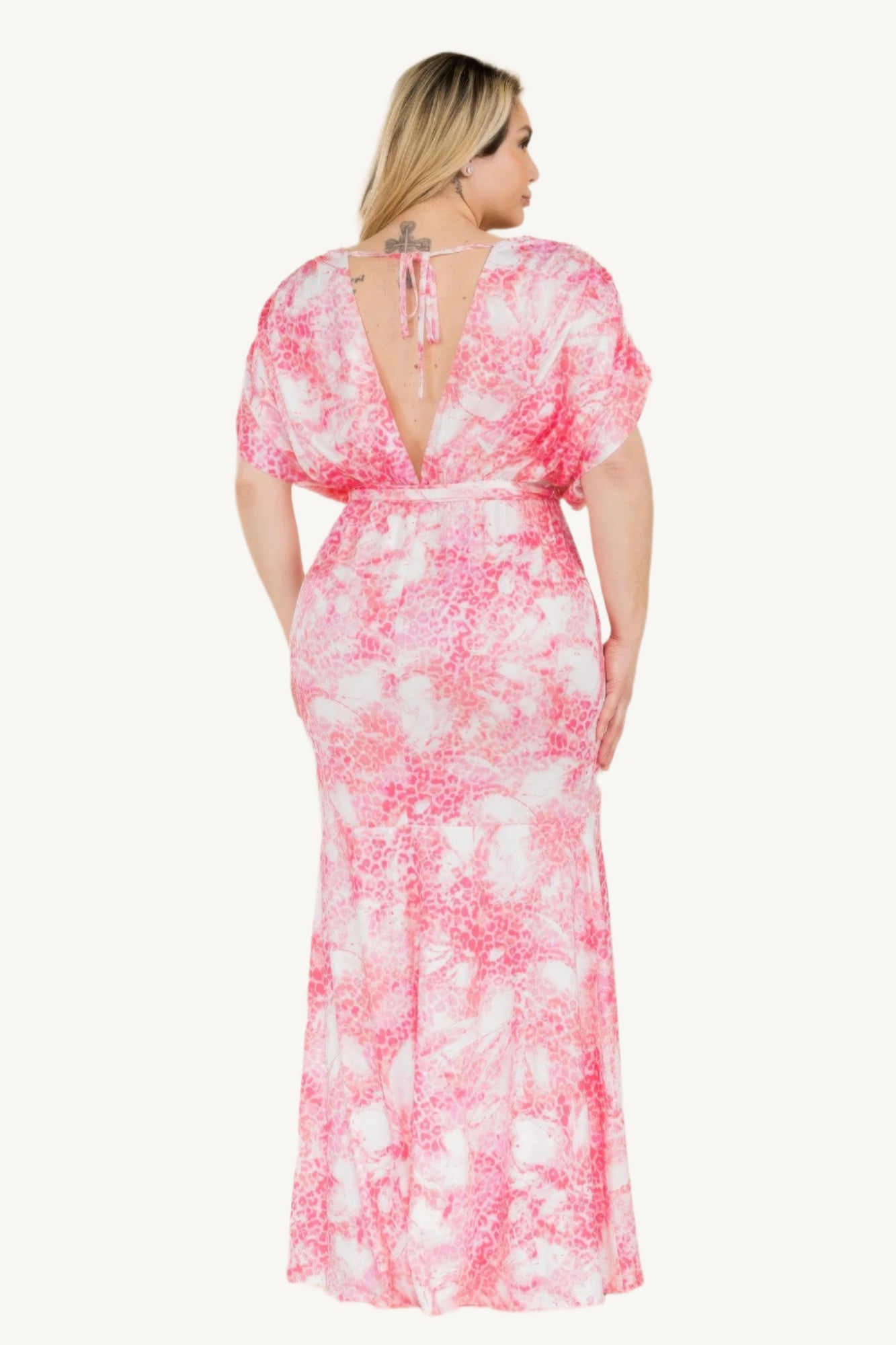 Plus-size printed mermaid maxi dress with tie waist and bold Venezia-inspired pattern. Flattering silhouette designed for elegant evenings and special occasions.