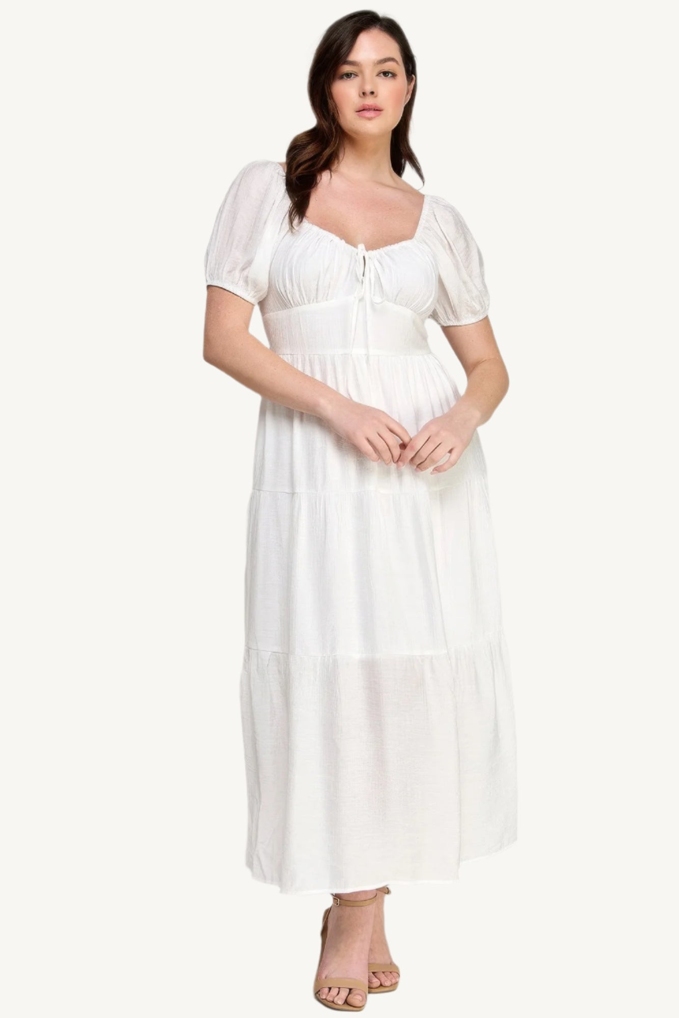 "White plus size tiered maxi dress with puff sleeves and front tie detail, crafted from lightweight polyester for a fresh and feminine look."