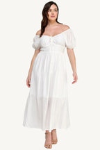 "White plus size tiered maxi dress with puff sleeves and front tie detail, crafted from lightweight polyester for a fresh and feminine look."
