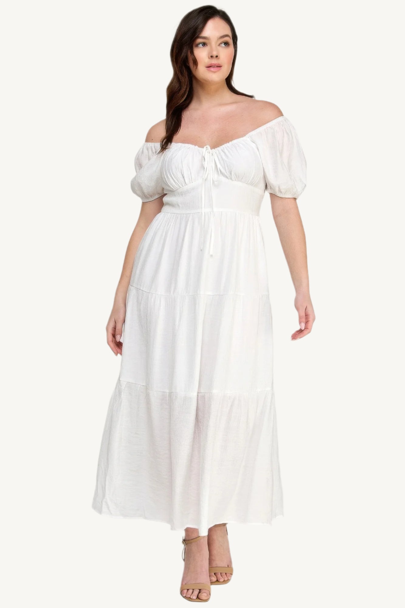 "White plus size tiered maxi dress with puff sleeves and front tie detail, crafted from lightweight polyester for a fresh and feminine look."