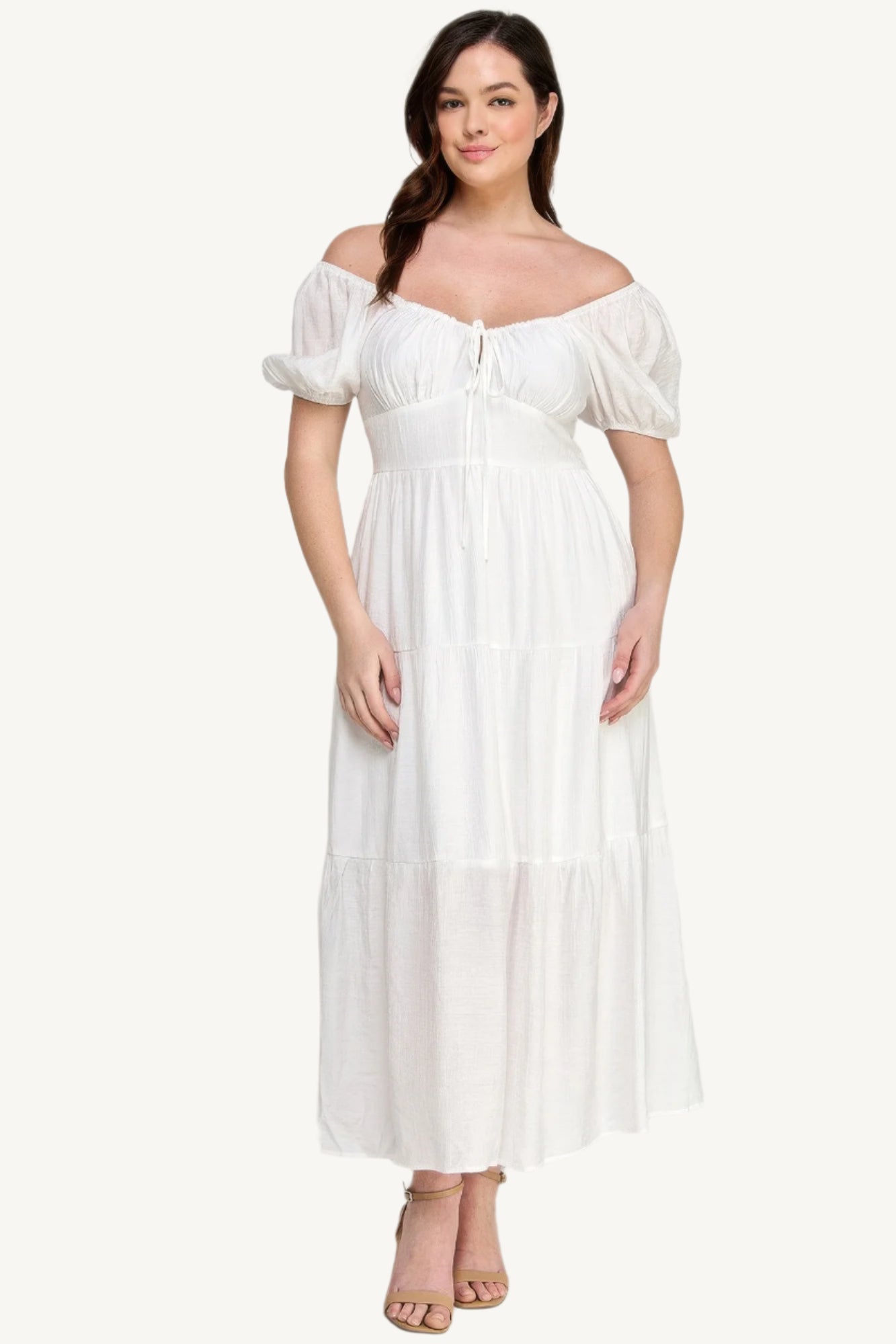 "White plus size tiered maxi dress with puff sleeves and front tie detail, crafted from lightweight polyester for a fresh and feminine look."