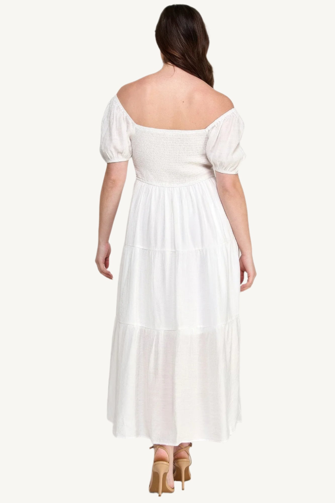 "White plus size tiered maxi dress with puff sleeves and front tie detail, crafted from lightweight polyester for a fresh and feminine look."