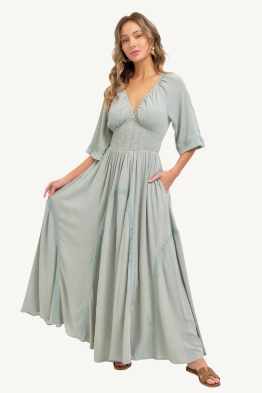 Flowy rayon maxi dress with smocked bodice, V-neckline, lace trim skirt, and breezy silhouette – romantic, feminine, and effortlessly elegant.