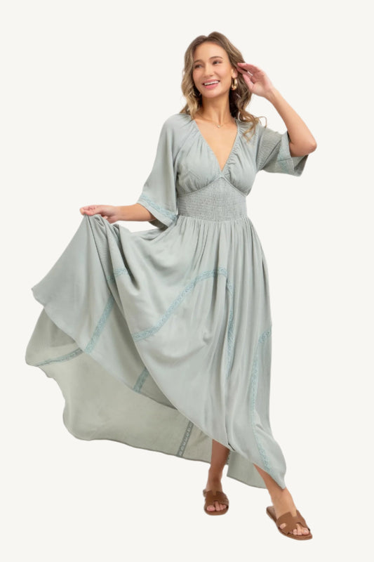 Flowy rayon maxi dress with smocked bodice, V-neckline, lace trim skirt, and breezy silhouette – romantic, feminine, and effortlessly elegant.