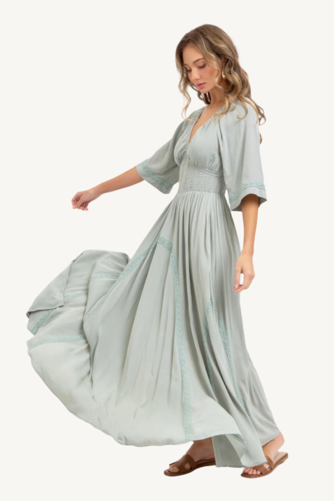 Flowy rayon maxi dress with smocked bodice, V-neckline, lace trim skirt, and breezy silhouette – romantic, feminine, and effortlessly elegant.