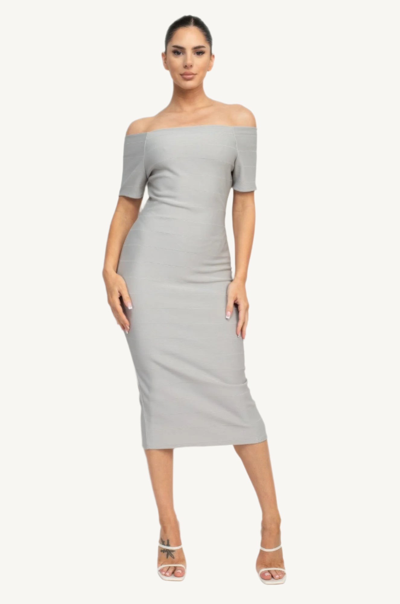 Off-shoulder bodycon dress with short sleeves, back zipper, and knee-length slit – made from soft stretch knit for a flattering, elegant fit.