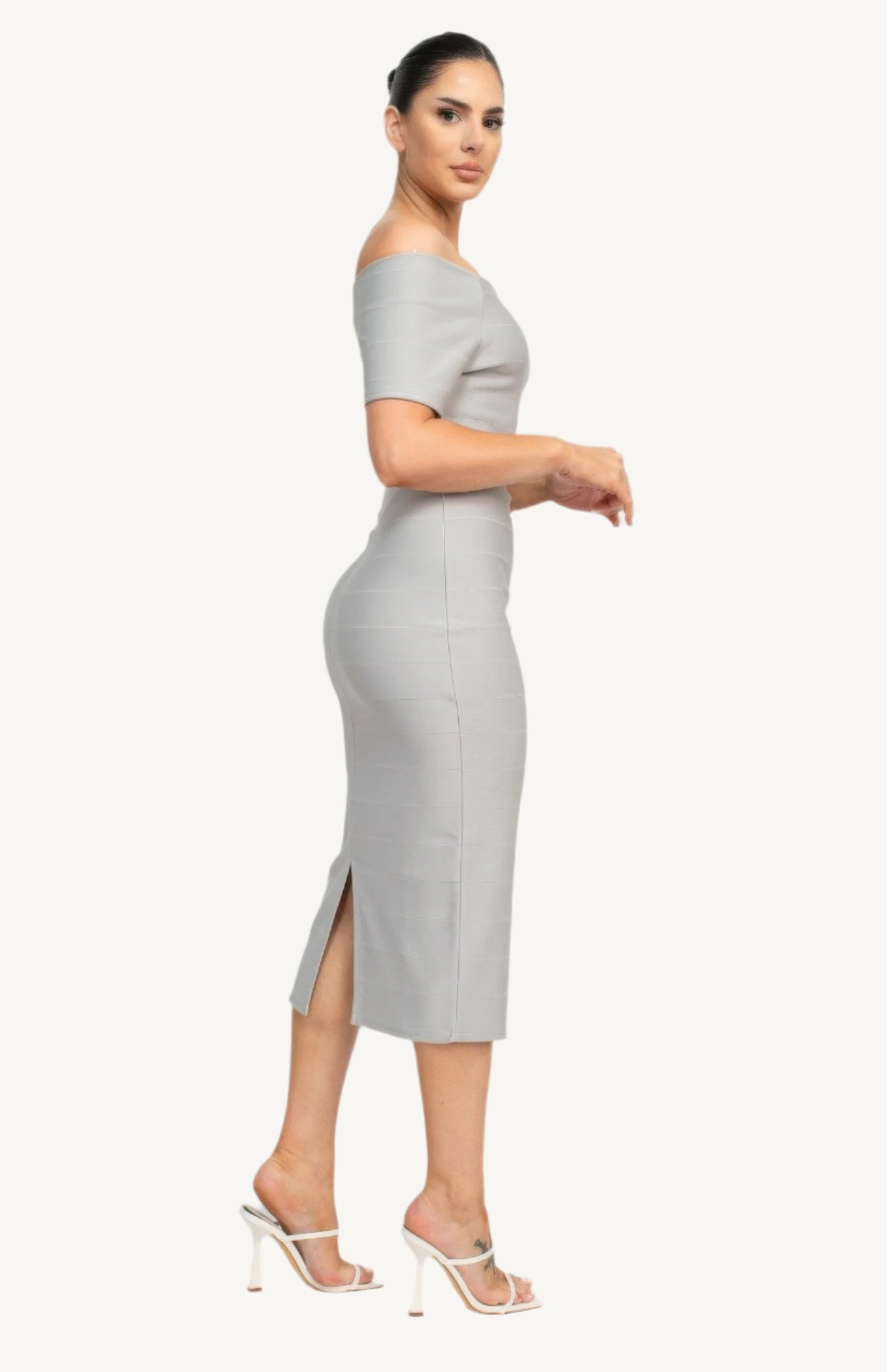 Off-shoulder bodycon dress with short sleeves, back zipper, and knee-length slit – made from soft stretch knit for a flattering, elegant fit.