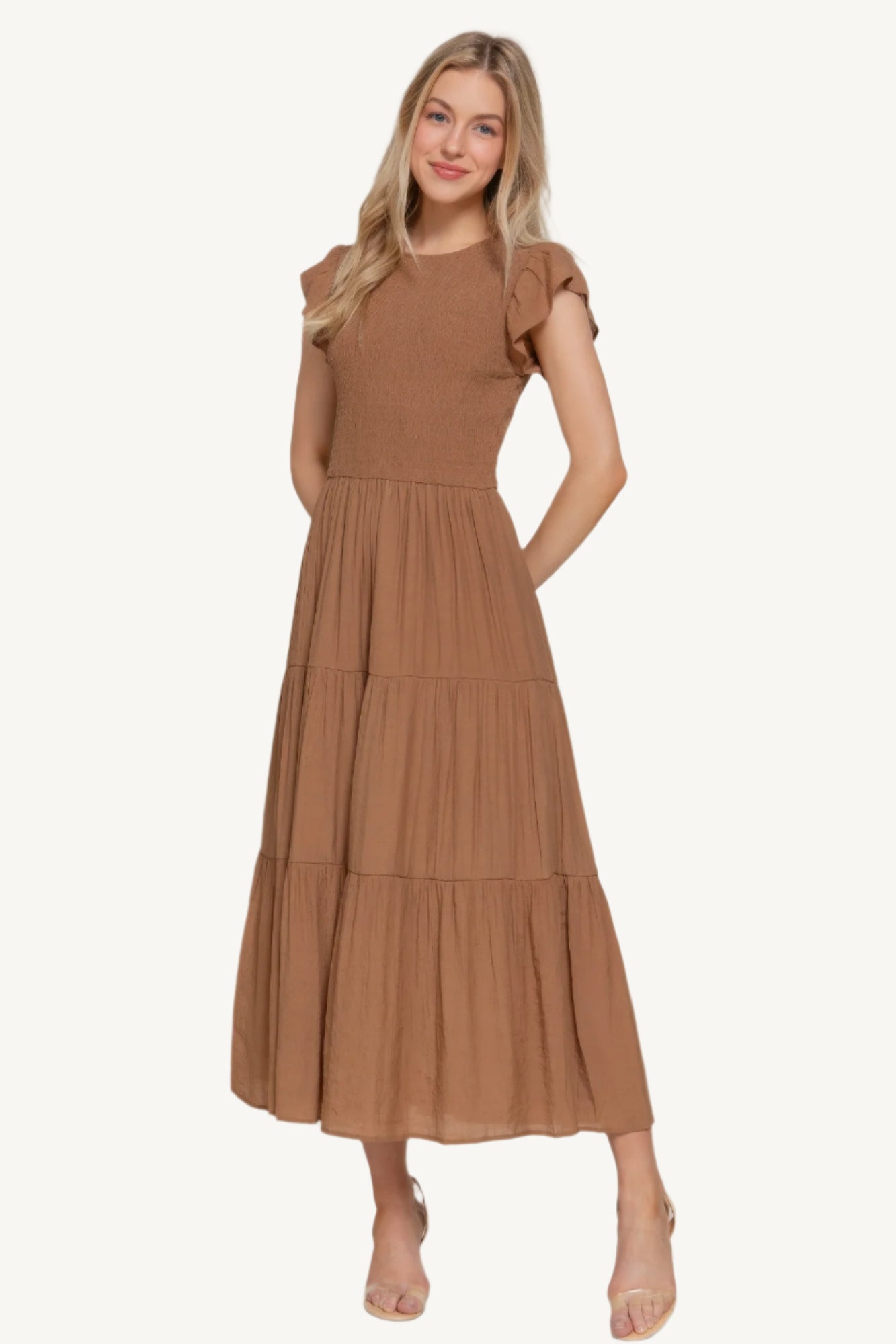 Ruffle sleeve tiered dress with smocked bodice and crew neckline, made from a lightweight rayon-polyester blend – romantic, flattering, and perfect for everyday wear.