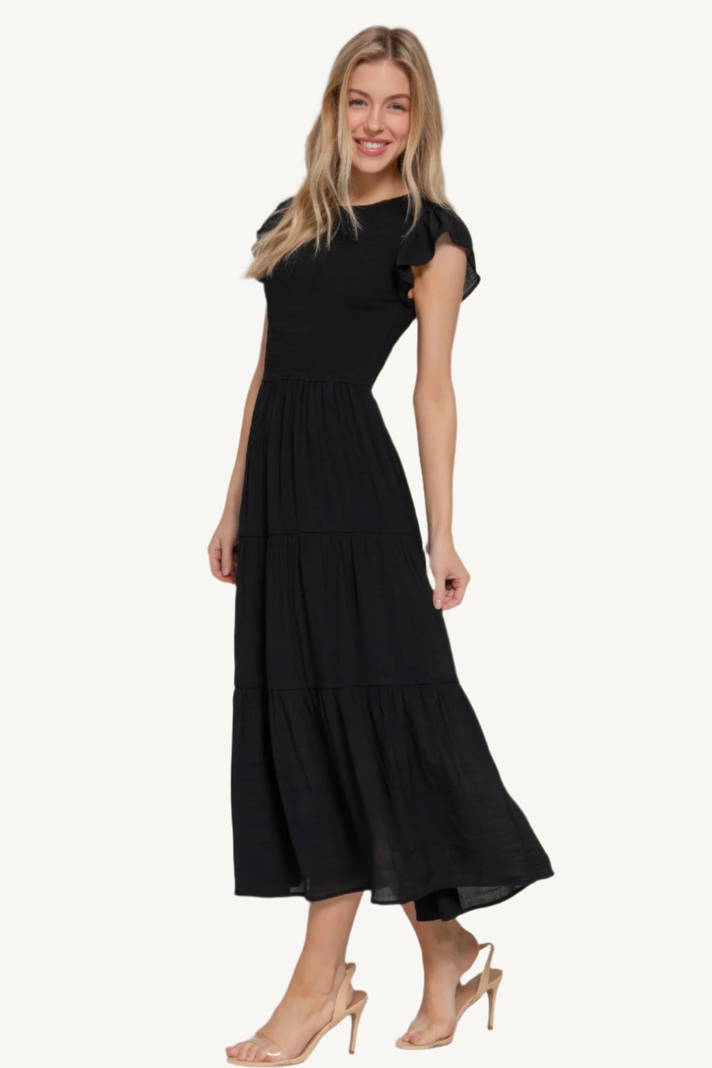Solid tiered dress with ruffle sleeves, smocked bodice, and crew neckline – lightweight rayon-polyester blend for a romantic and flattering everyday fit.